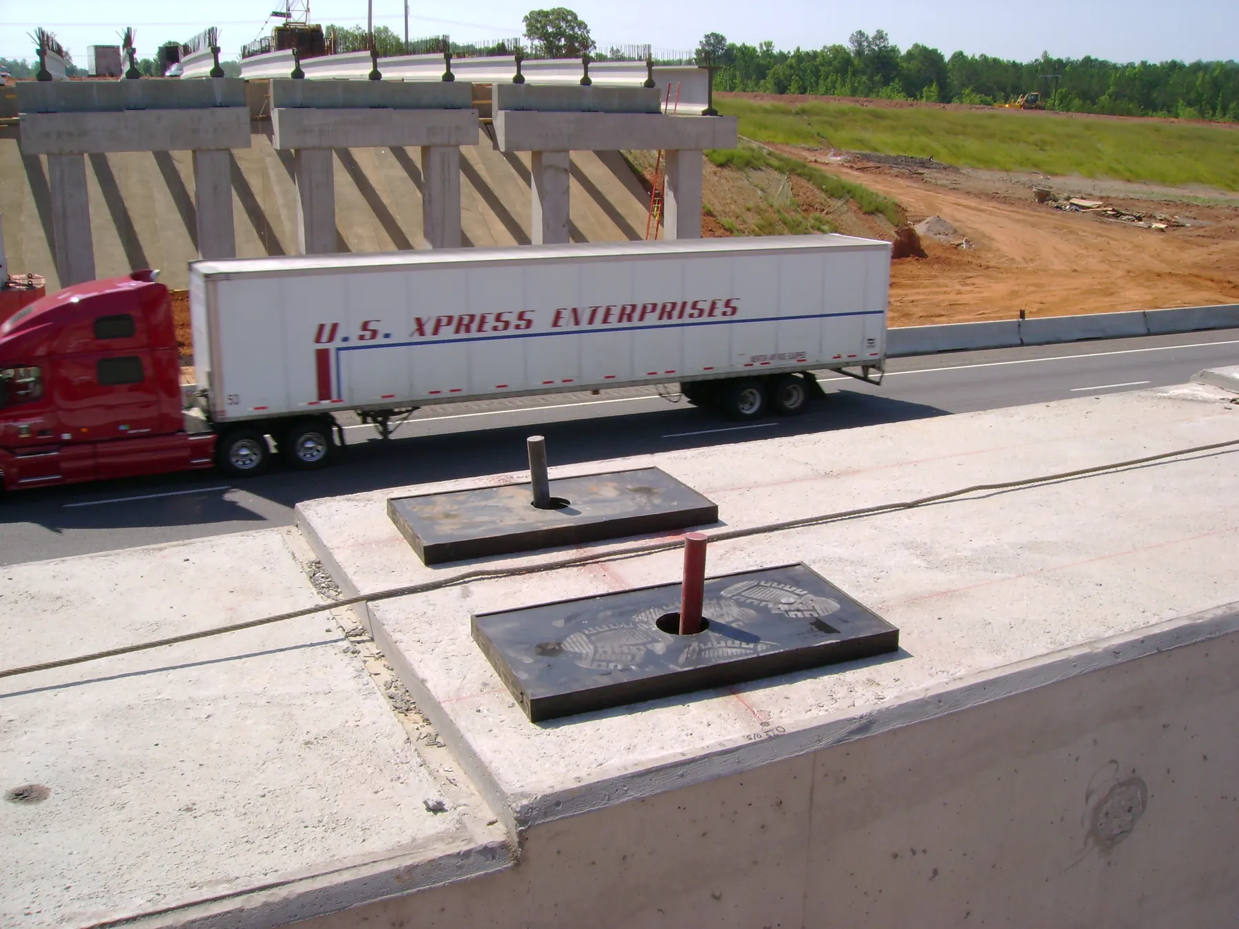 Elastomeric bearing pads set out on a bridge pier cap